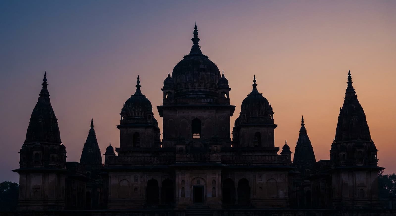 Temple spires silhouetted at dusk